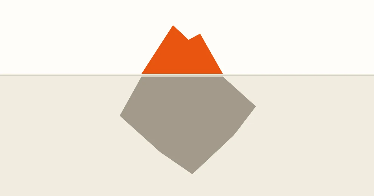 A flat iceberg with a small orange tip above a horizontal waterline and a larger warm taupe mass below it