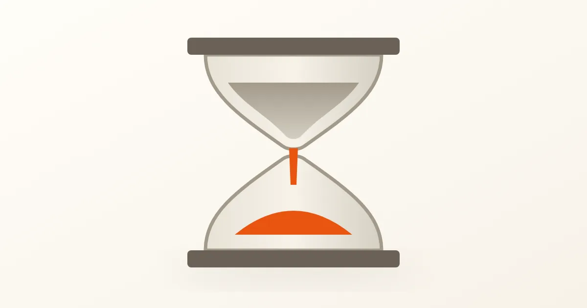 Un reloj de arena de tonos neutros cálidos con arena naranja que cae en la parte inferior